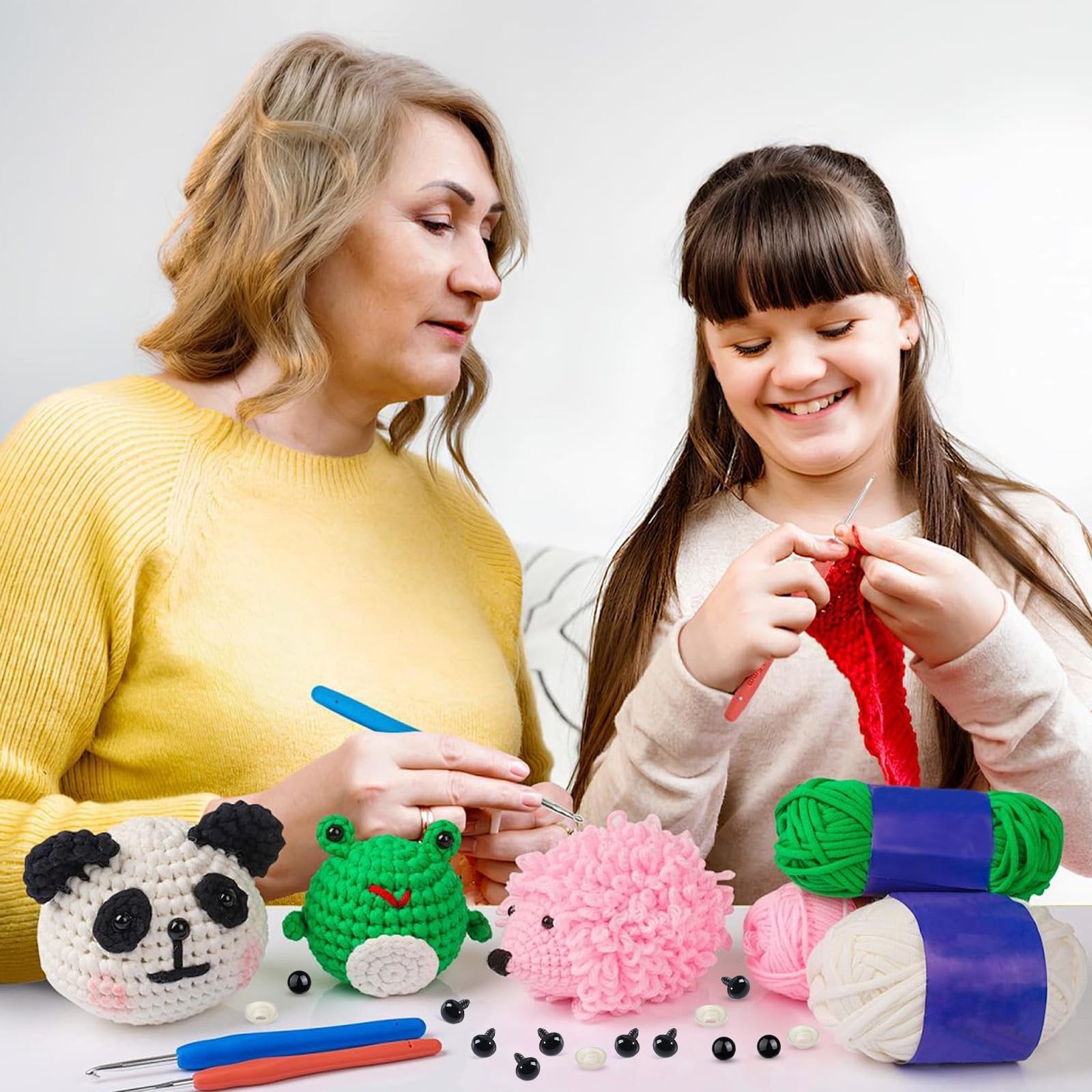 Woman and child crochet crafting with yarn and safety eyes