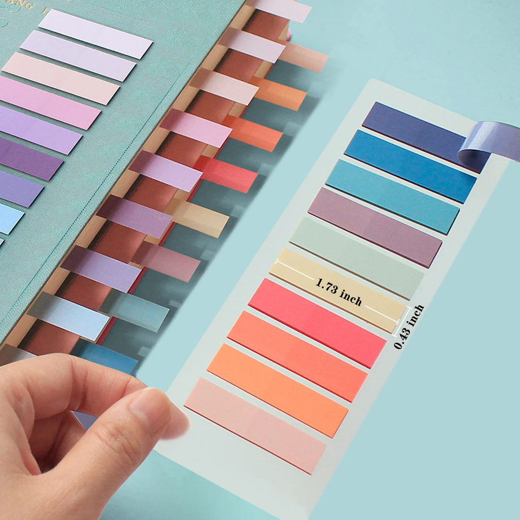 Hand applying colorful PET sticky page markers to a notebook, showing dimensions.