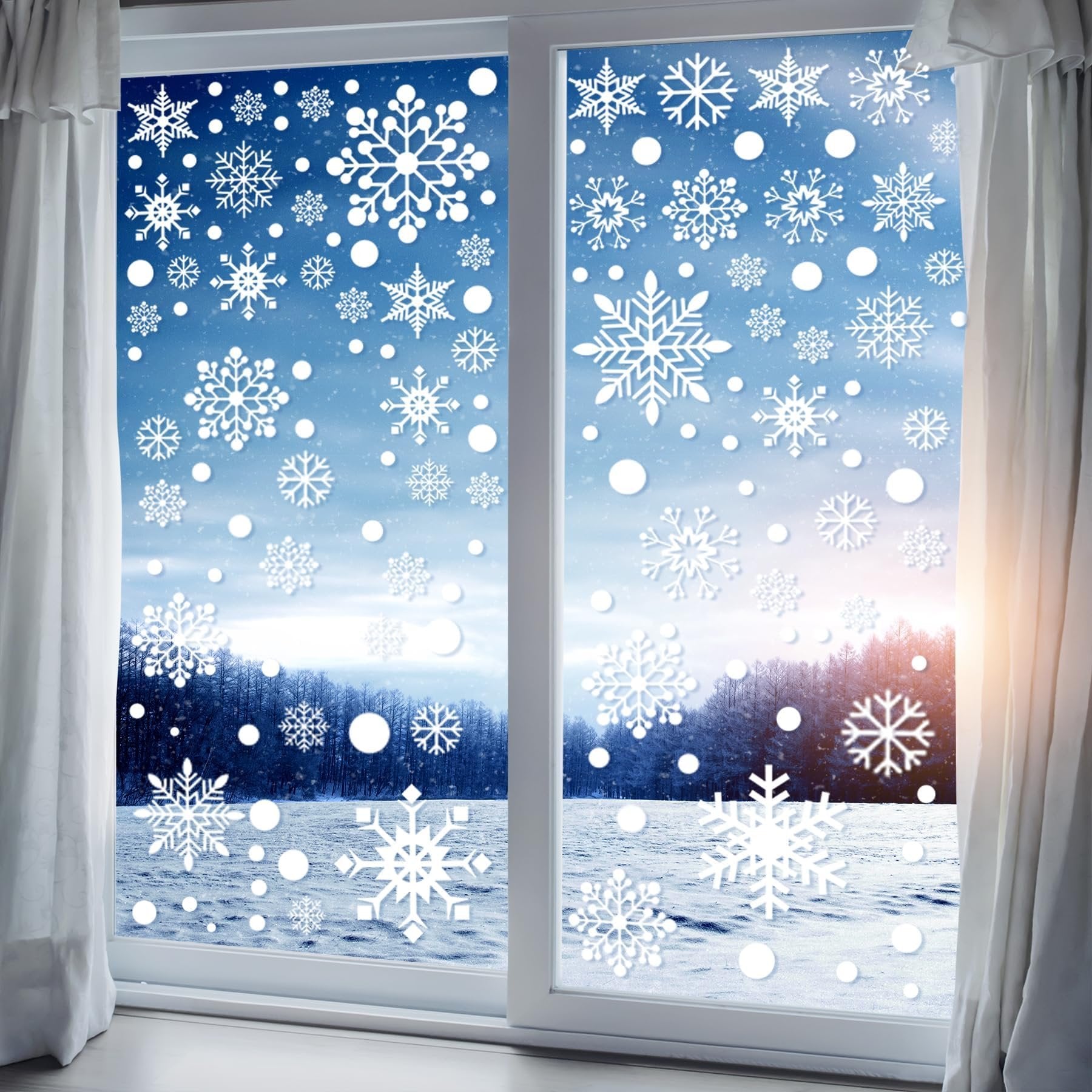 Christmas snowflake window decals applied to a window overlooking a snowy winter landscape with trees and curtains.