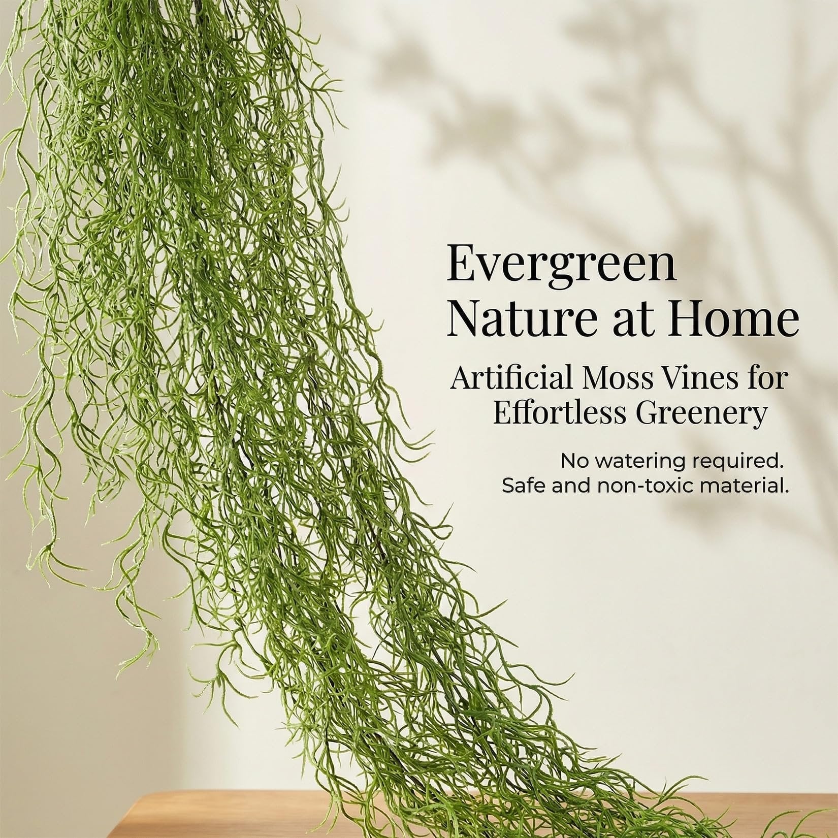Artificial Spanish moss garland hanging with text overlay about nature at home and effortless greenery.