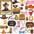 Western photo booth props including a wanted poster, cowboy hats, lips, a tequila bottle, and various signs.