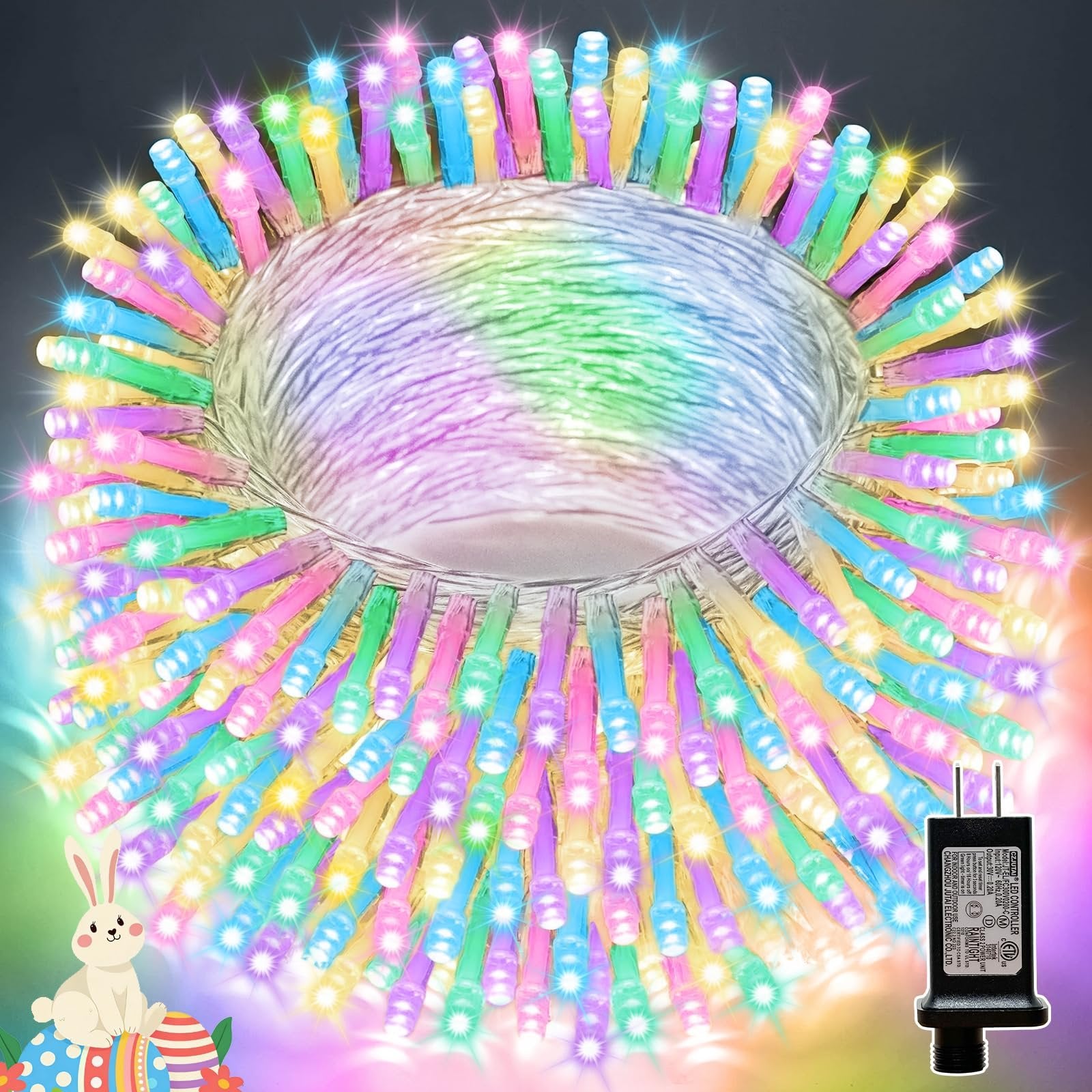 Close-up of pastel Easter string lights coiled on a spool, with a power adapter on the right and a cartoon bunny with Easter eggs on the left.