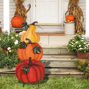 Stacked hand-painted pumpkins garden stake with wind-moving leaves for fall outdoor decor.