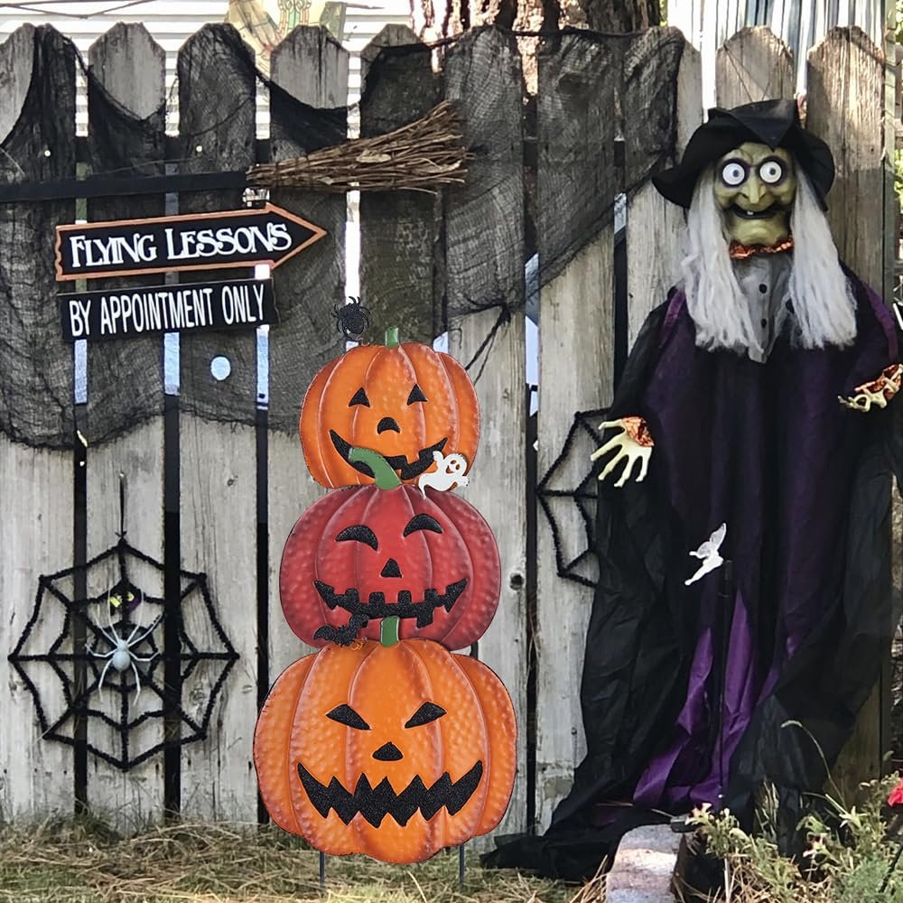 Stackable metal pumpkin garden stakes with Halloween decorations including a witch figure and signs.