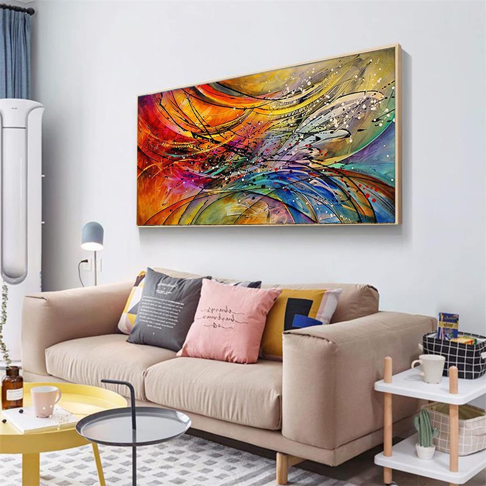 Abstract 5D diamond painting kit artwork displayed above a sofa in a living room setting