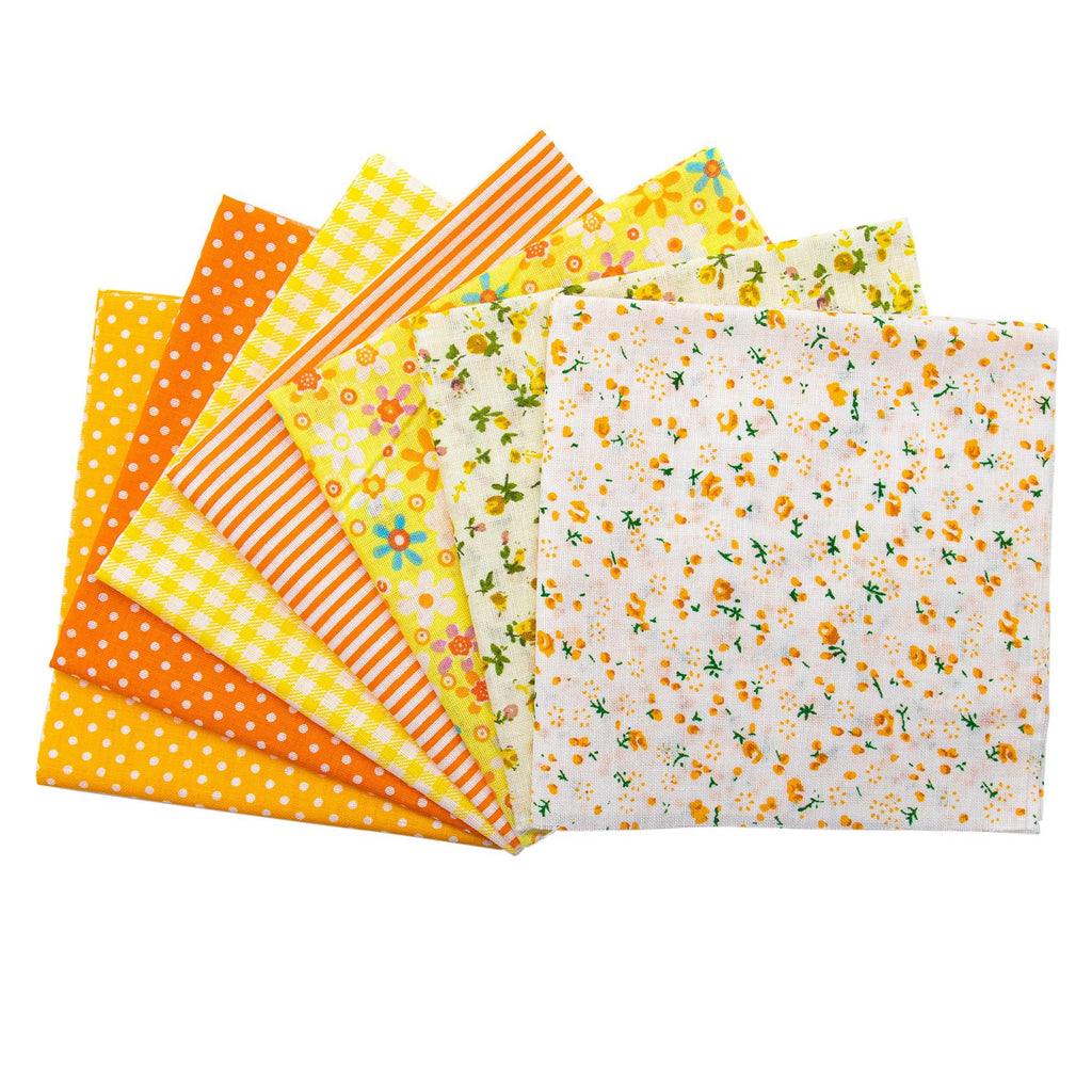 Fan of colorful cotton fabric squares with various patterns including polka dots, stripes, gingham, and floral prints on a white background.