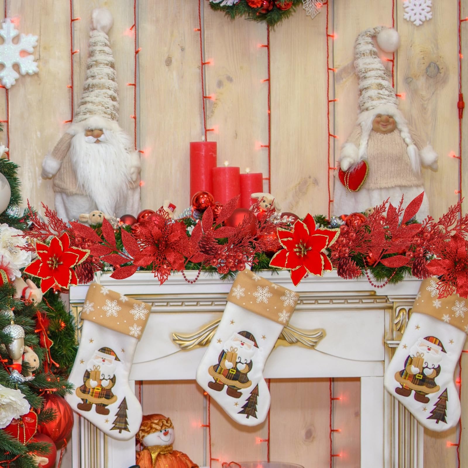 Christmas fireplace mantel decorated with red glitter poinsettias, garlands, stockings, and gnomes.