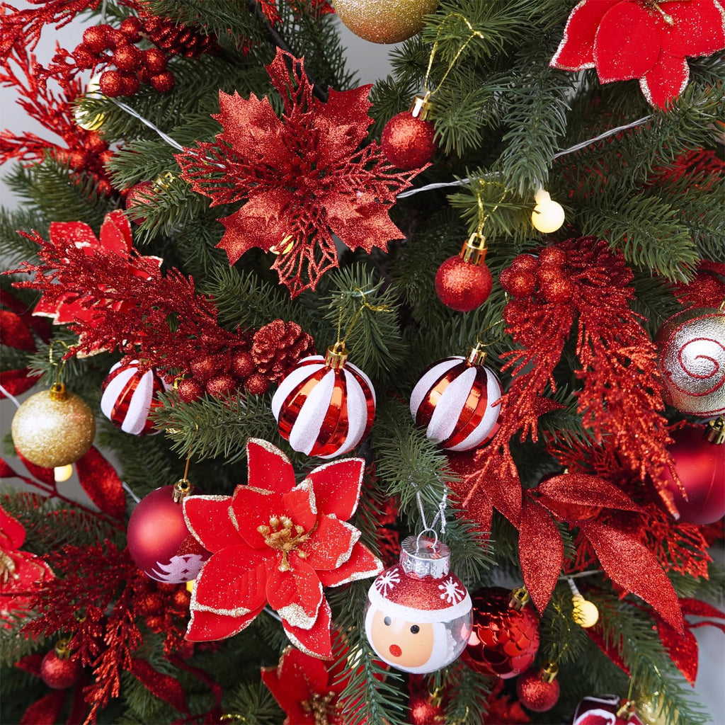Close-up of a decorated Christmas tree with red glitter poinsettias, ornaments, and lights.