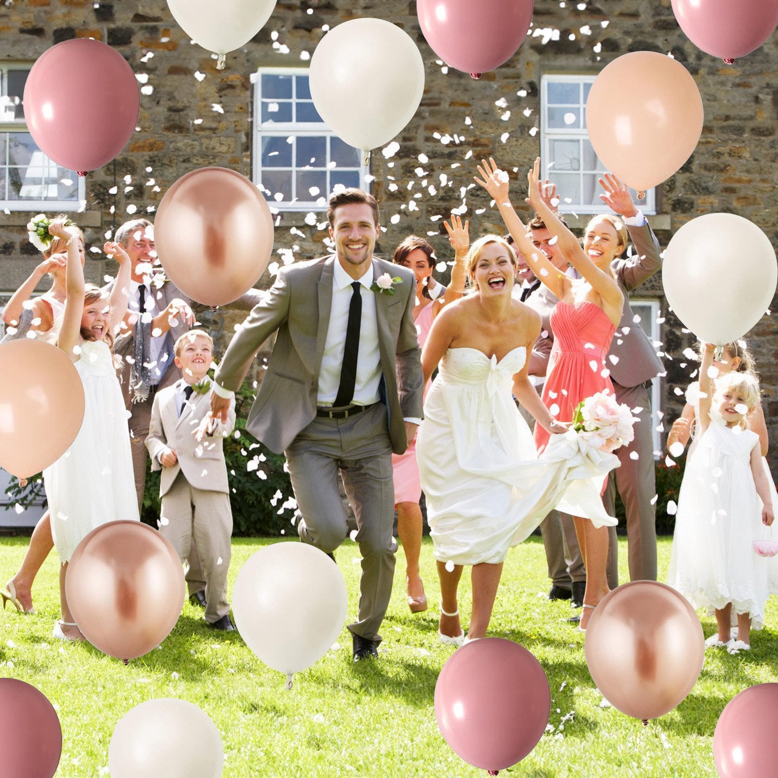 Wedding party running through confetti with balloons in sage green, beige, sand white, and gold.