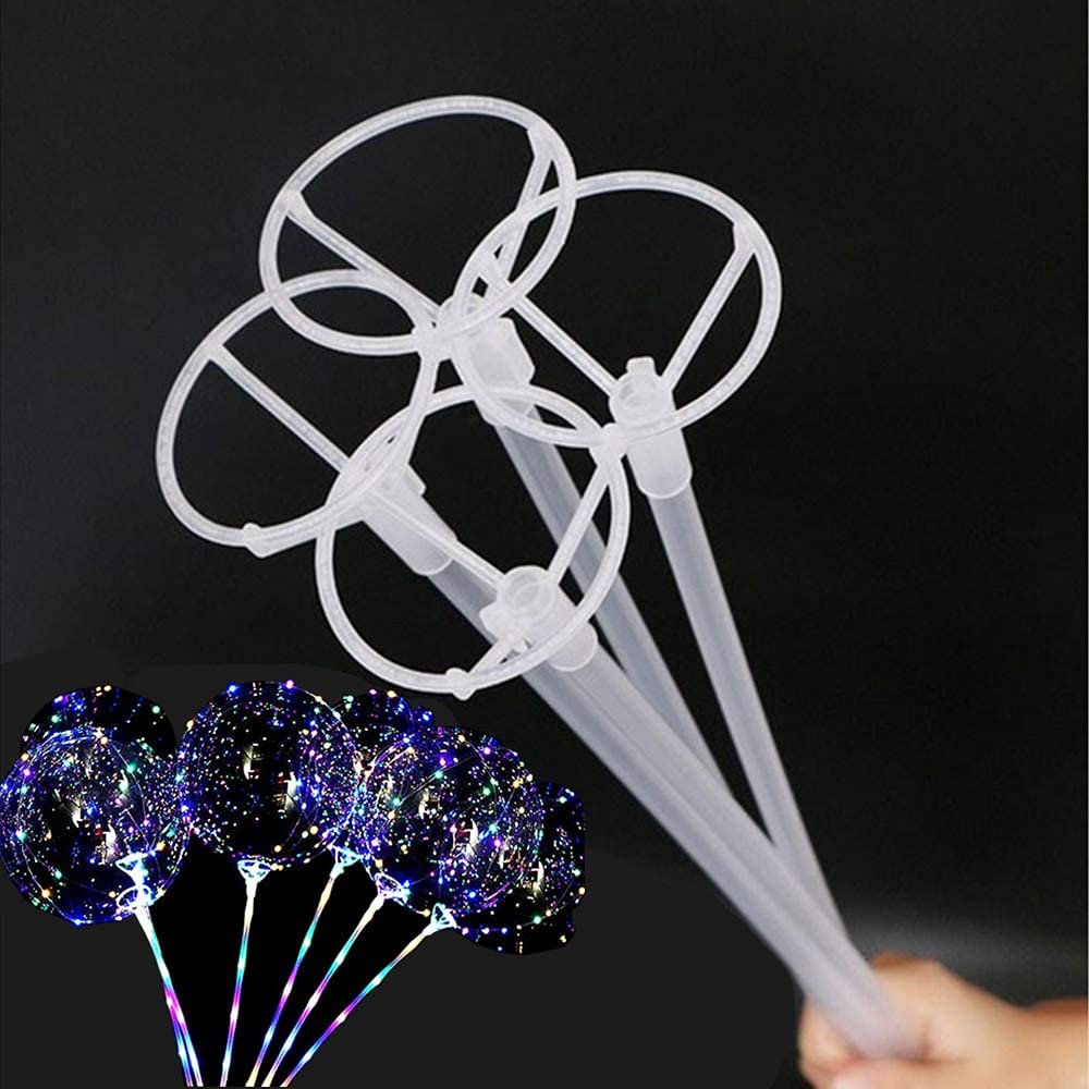 Clear plastic balloon sticks with cups and illuminated balloons on black background