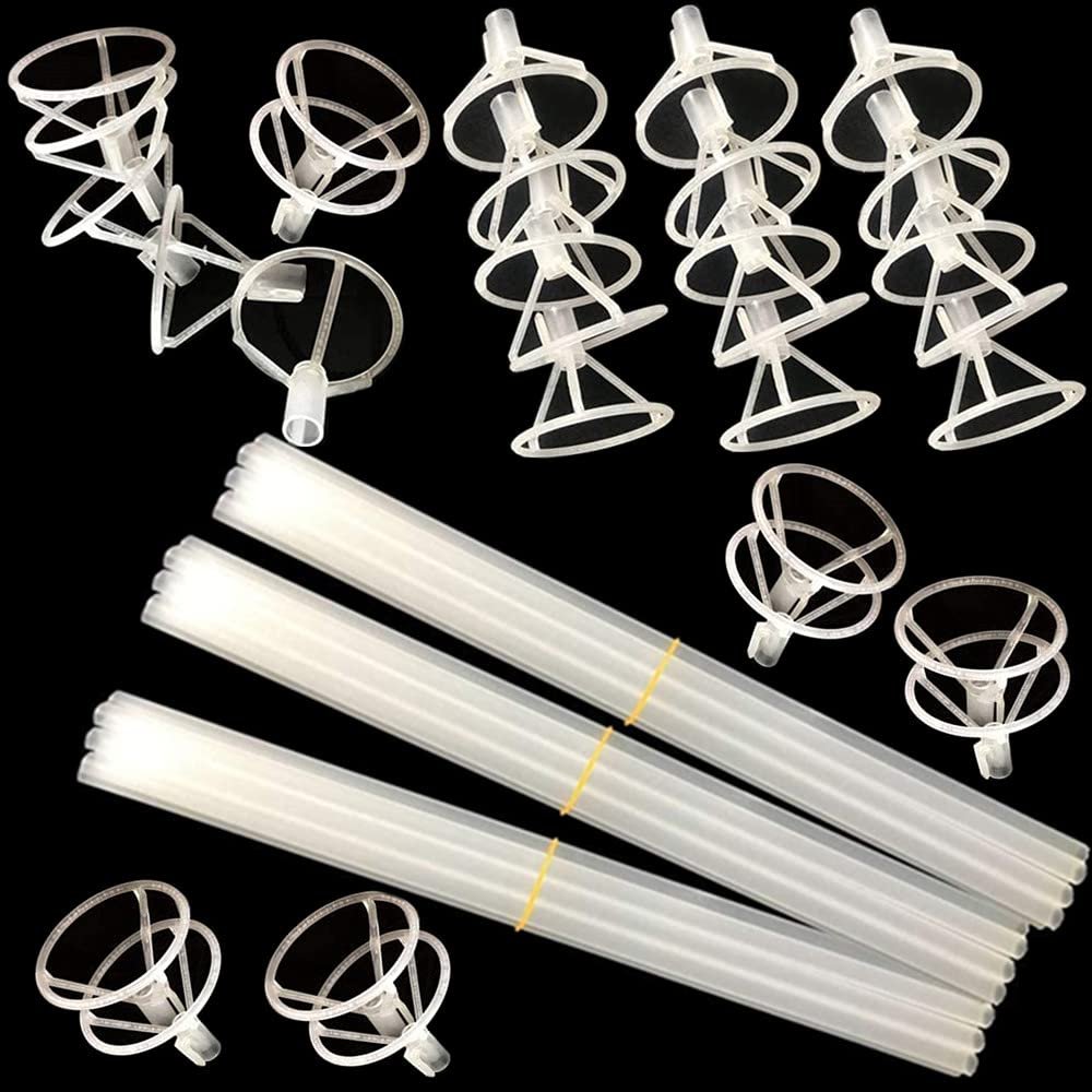 Clear plastic balloon sticks and cups arranged on a black background, showing multiple assembled sticks and loose cups.