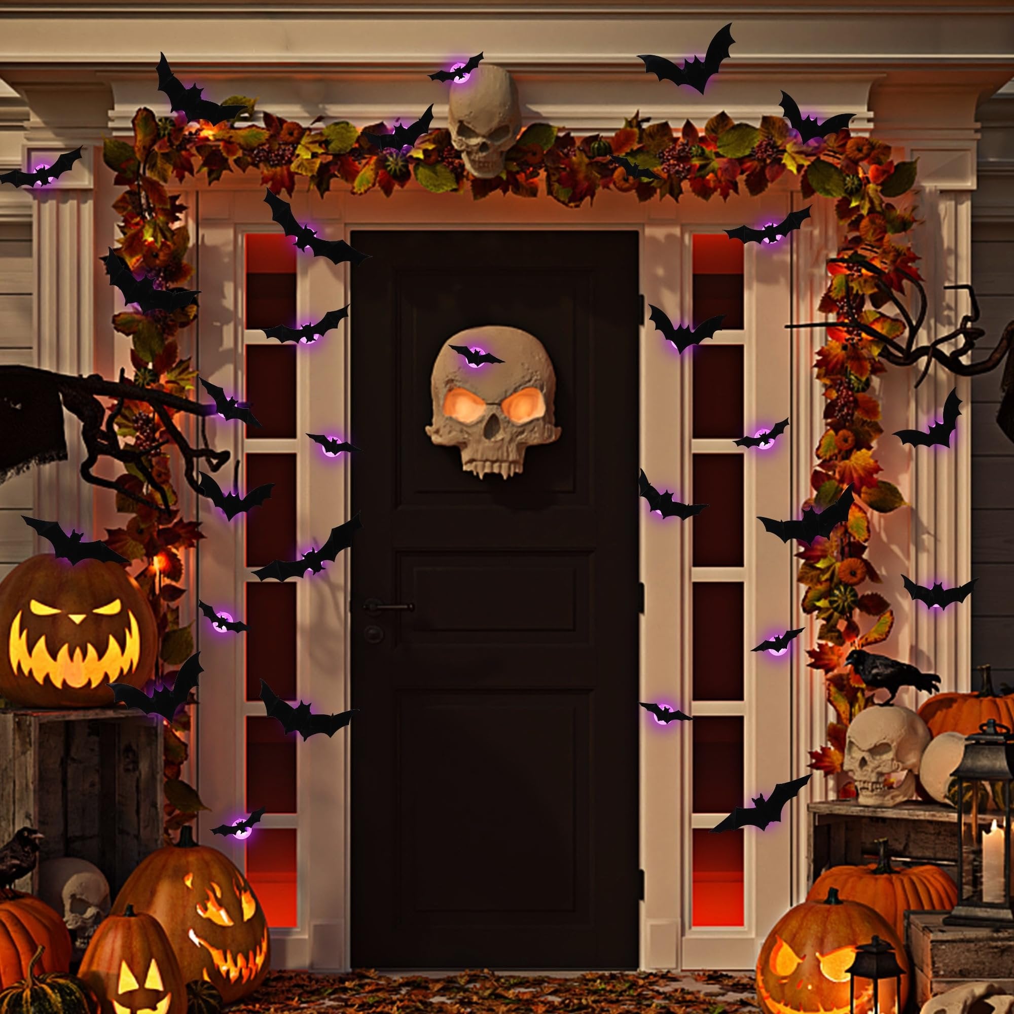 Halloween decorated doorway with black bats, pumpkins, and a skull decoration. Lights glow from pumpkins and bats.