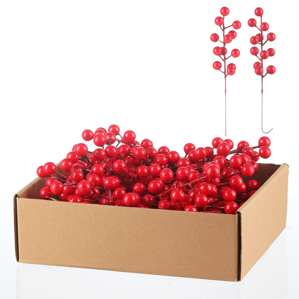 Box of artificial red berry stems with two stems displayed above