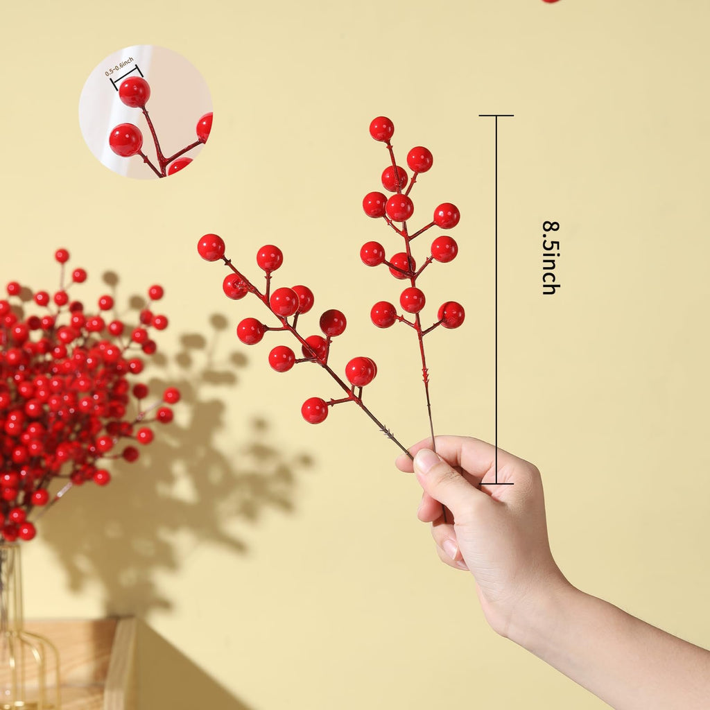 Hand holding artificial red berry stems, with a close-up inset showing berry size and a measurement indicating 8.5 inches.