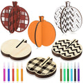 Fall craft kit with assorted wooden pumpkin cutouts and colored markers on a white background.