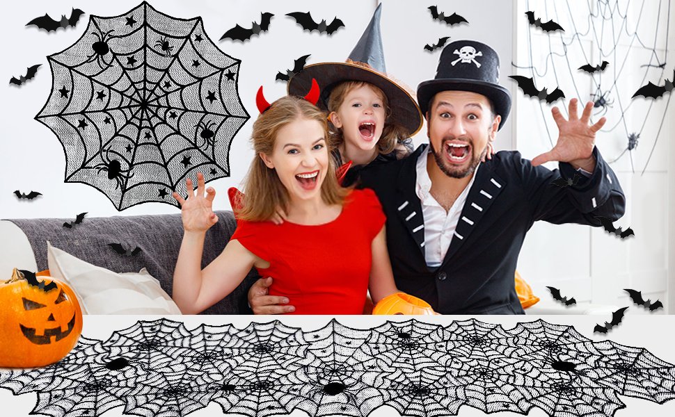Family in Halloween costumes celebrating with spiderweb and bat decorations