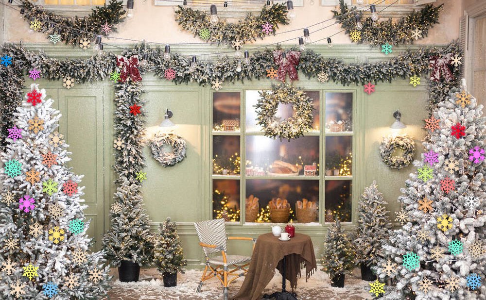 Christmas trees decorated with colorful snowflake ornaments and garlands, with a window display and table in the background.