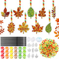 Autumn leaf suncatcher paint kit contents including paint pots, brushes, beads, and leaf frames.