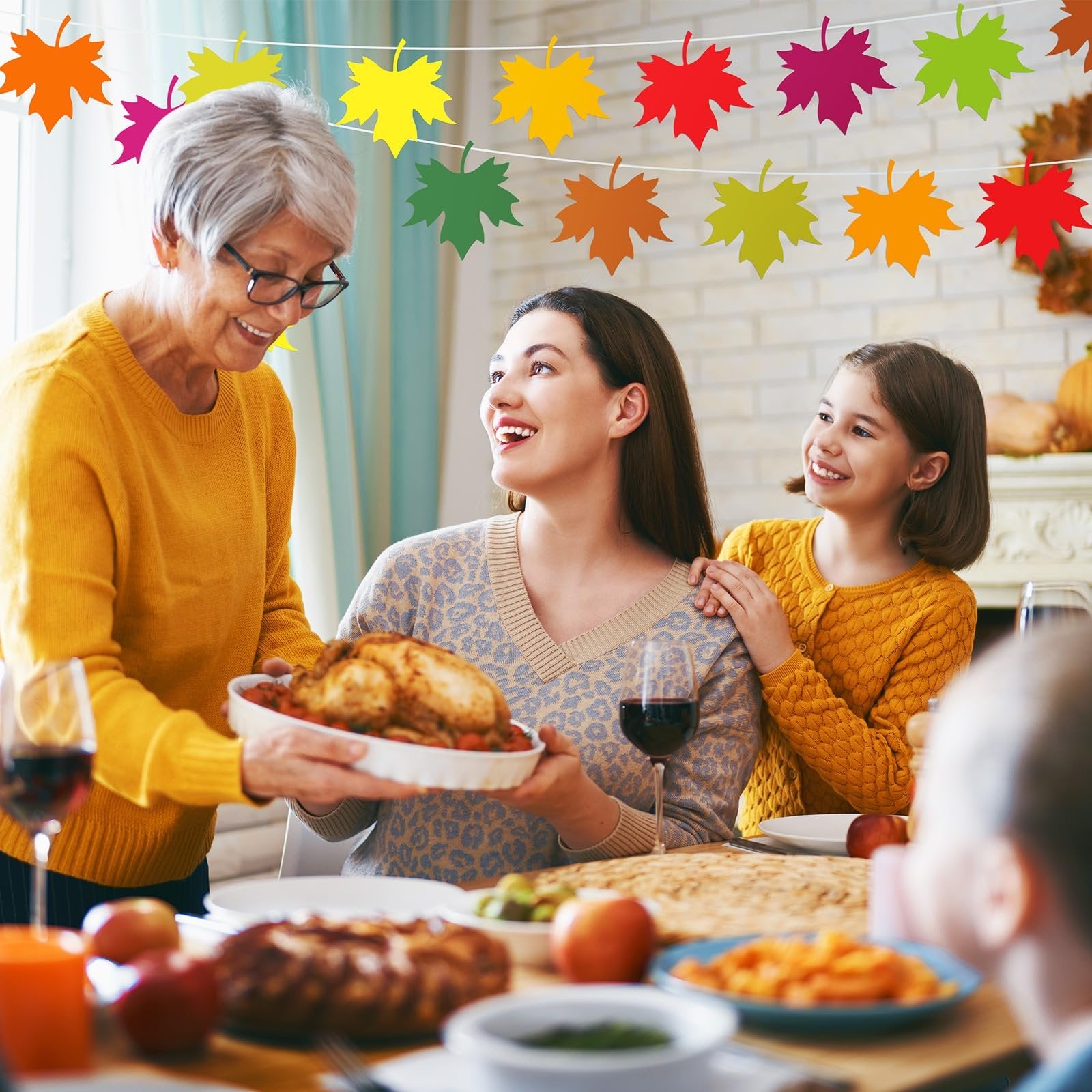 Family enjoying a Thanksgiving dinner with a roasted turkey and fall leaf decorations