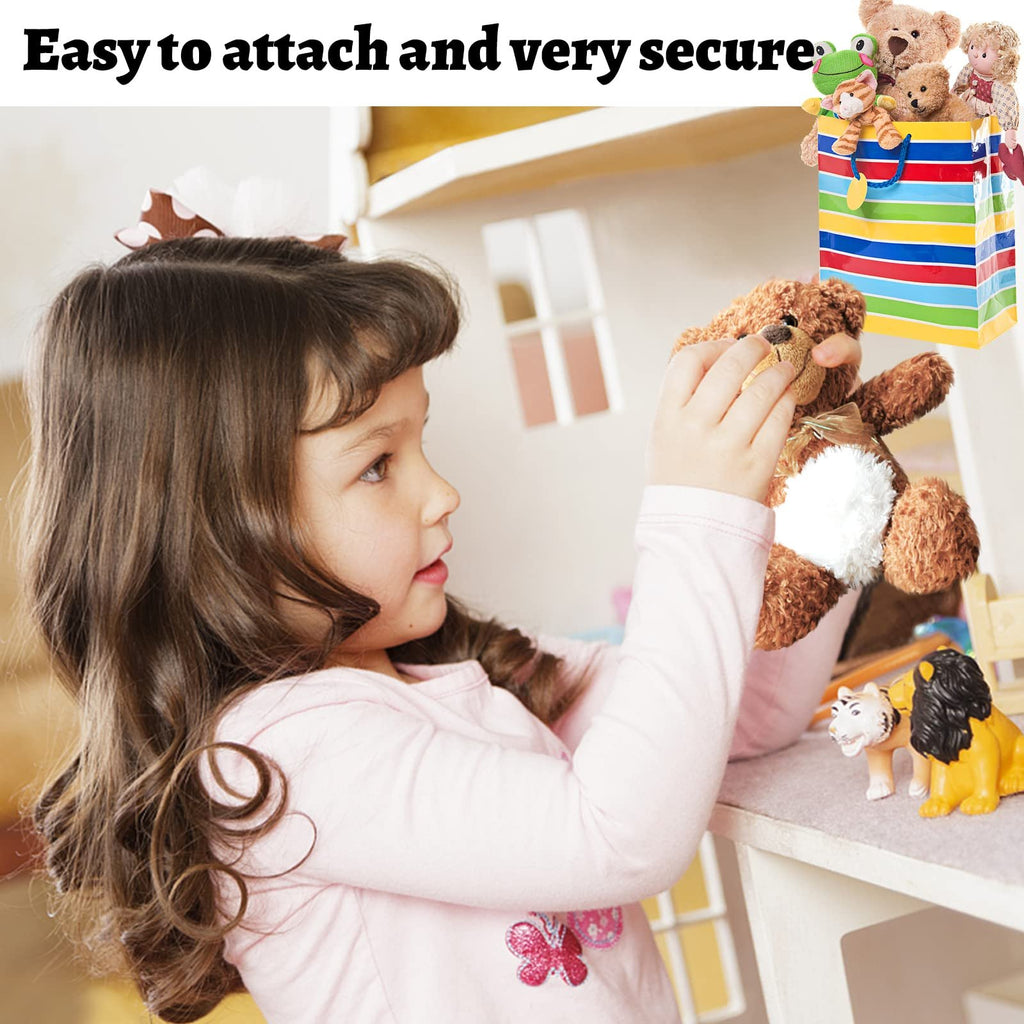 Child playing with stuffed animals near a dollhouse, with a colorful bag of toys.