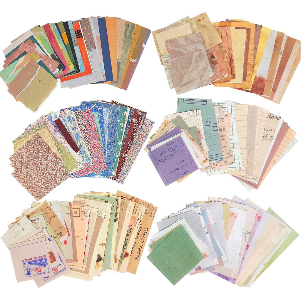 Assortment of vintage scrapbook paper sheets in various styles and patterns, fanned out against a white background.
