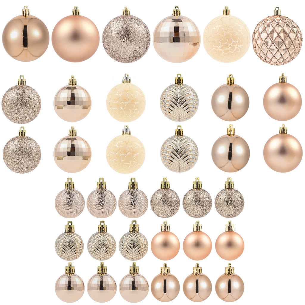 Collection of copper orange Christmas ball ornaments in various styles and sizes, displayed against a white background.