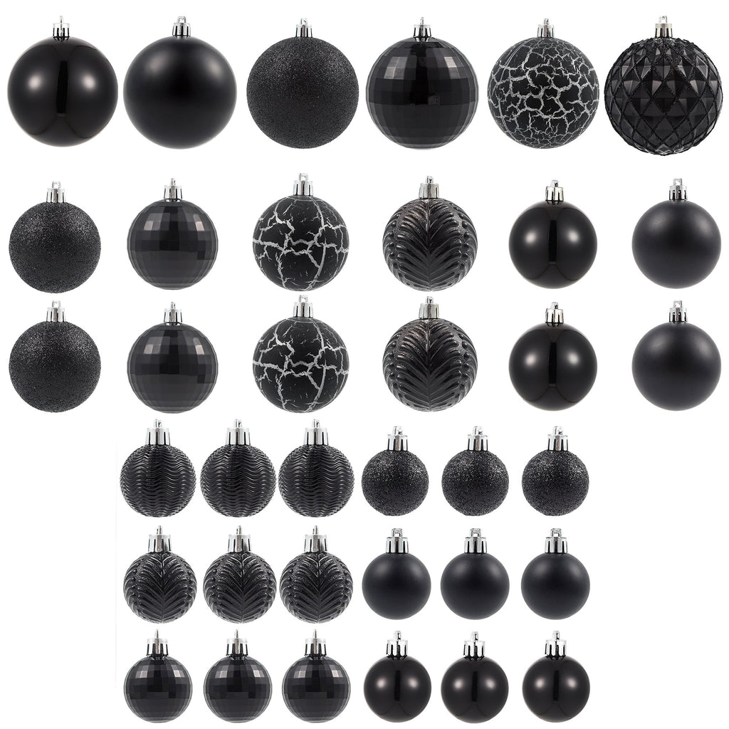 Collection of black Christmas ball ornaments in various sizes and textures, arranged in rows.