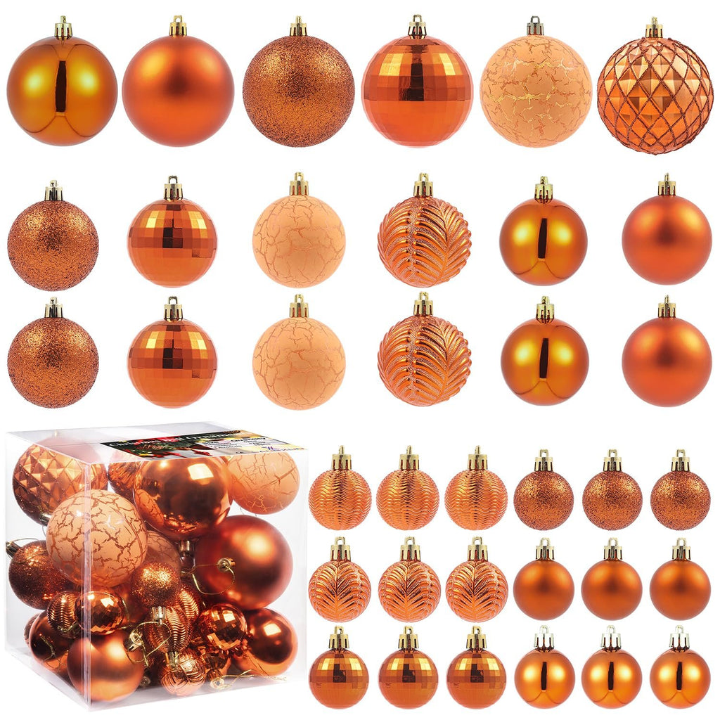 Copper orange Christmas ball ornaments in various sizes and styles, displayed in a clear box and arranged in rows.