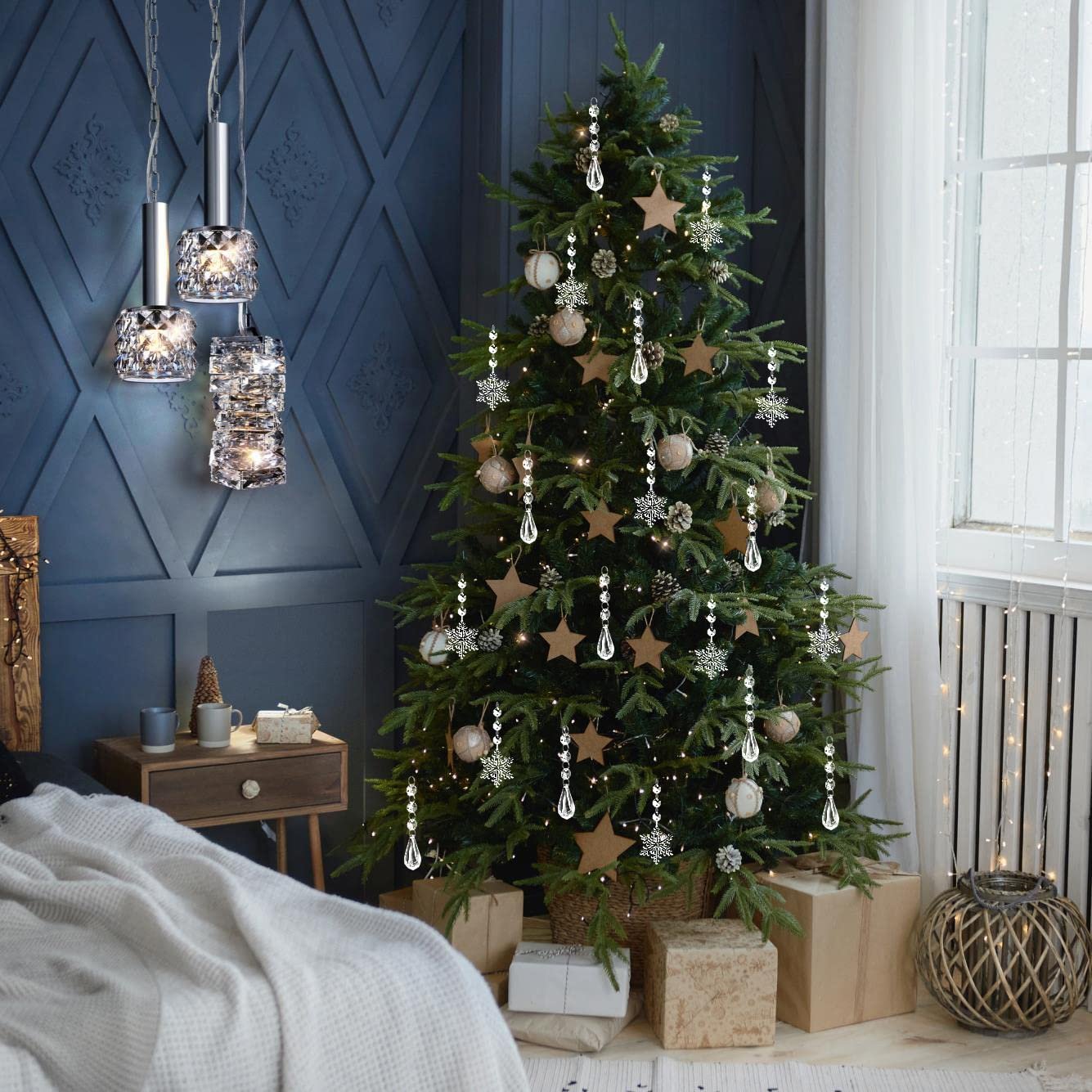 Christmas tree decorated with clear acrylic snowflake and icicle ornaments, star shapes, and pinecones.