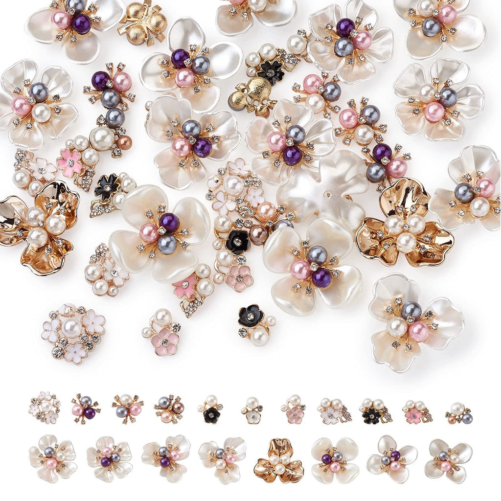 Assortment of floral flatback cabochons with pearls and rhinestones on white background