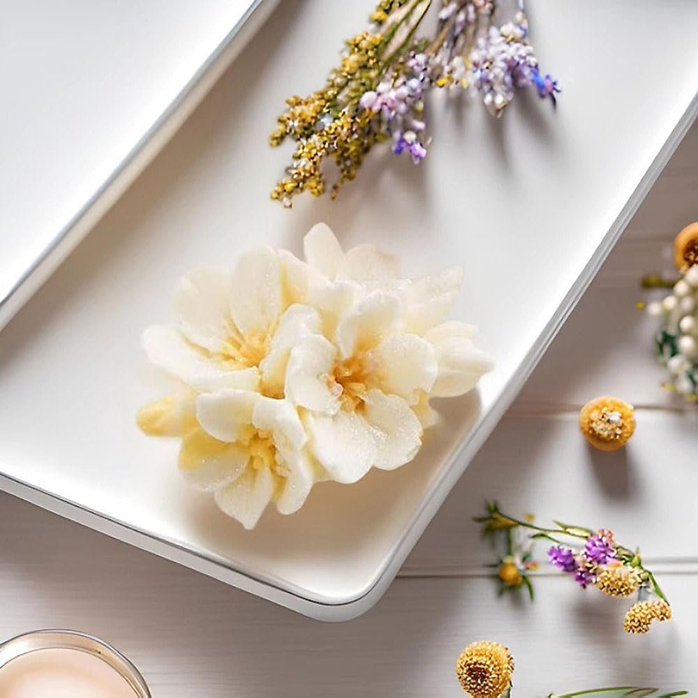 White cherry blossom flower silicone mold on a white tray with dried flowers