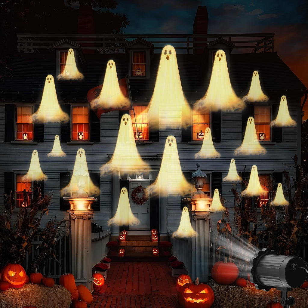 Halloween house projection with multiple glowing ghosts appearing on the facade and in windows, with pumpkins and hay bales in the foreground.
