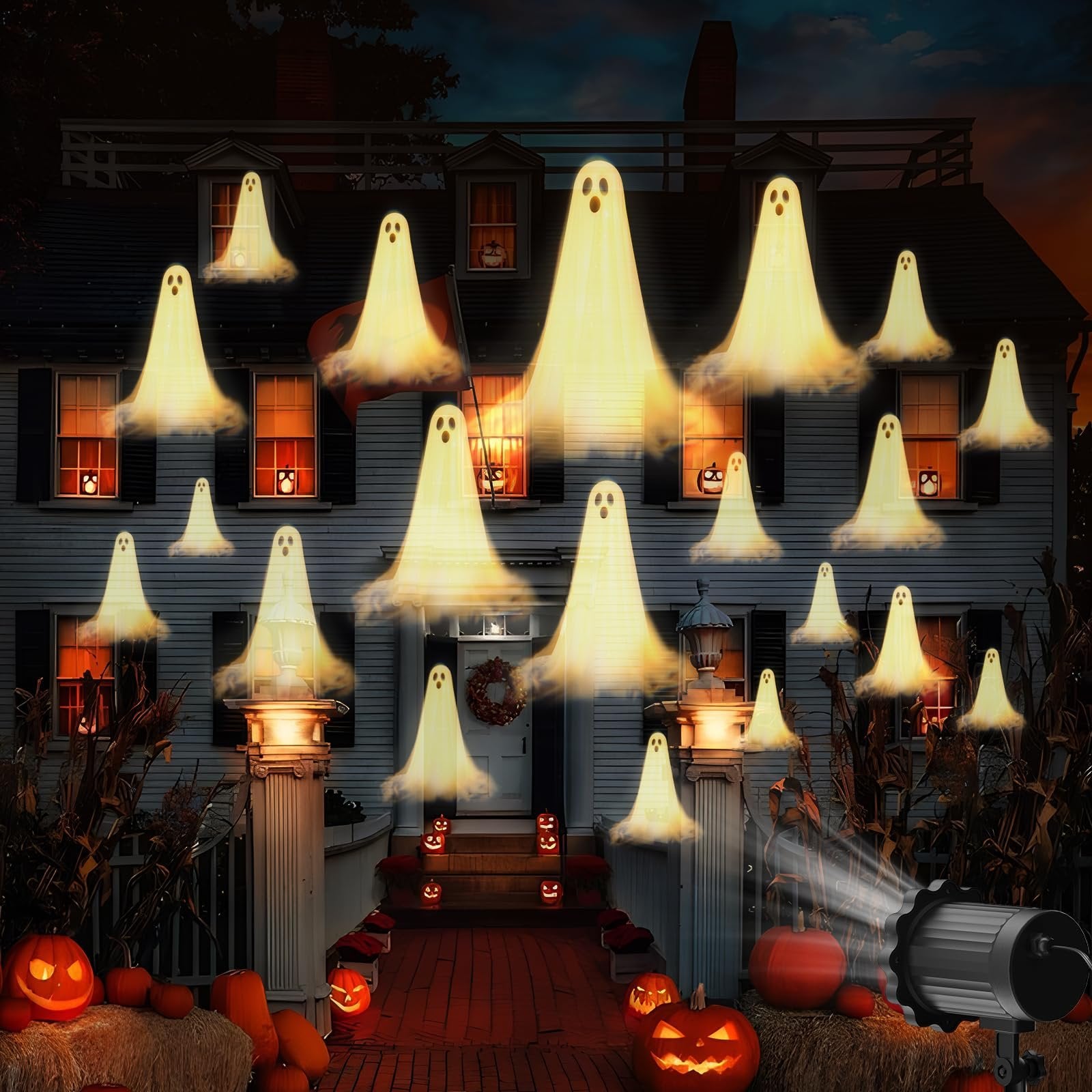 Halloween house projection with multiple glowing ghosts appearing on the facade and in windows, with pumpkins and hay bales in the foreground.