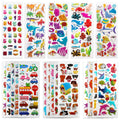 Sheets of puffy 3D stickers featuring animals, vehicles, numbers, and fruits, arranged in a grid.
