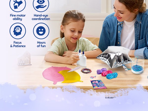 Mother and daughter crafting a 3D string art kit with balloon shapes and yarn on a wooden table.