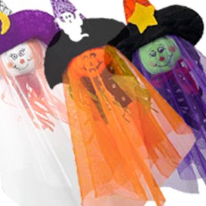 Three Halloween hanging ghost decorations with witch hats and colorful skirts
