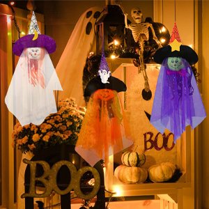 Three Halloween hanging ghost decorations with witch hats and pumpkins, displayed outdoors with other spooky decor.