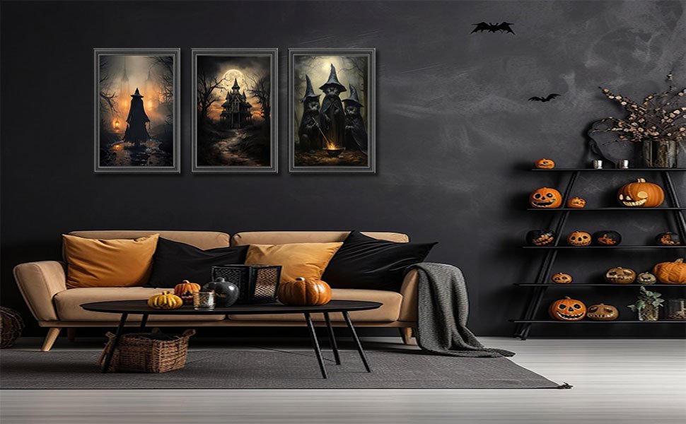 Three framed Halloween canvas art prints depicting witches and a haunted castle, displayed above a sofa with pumpkins and decor.