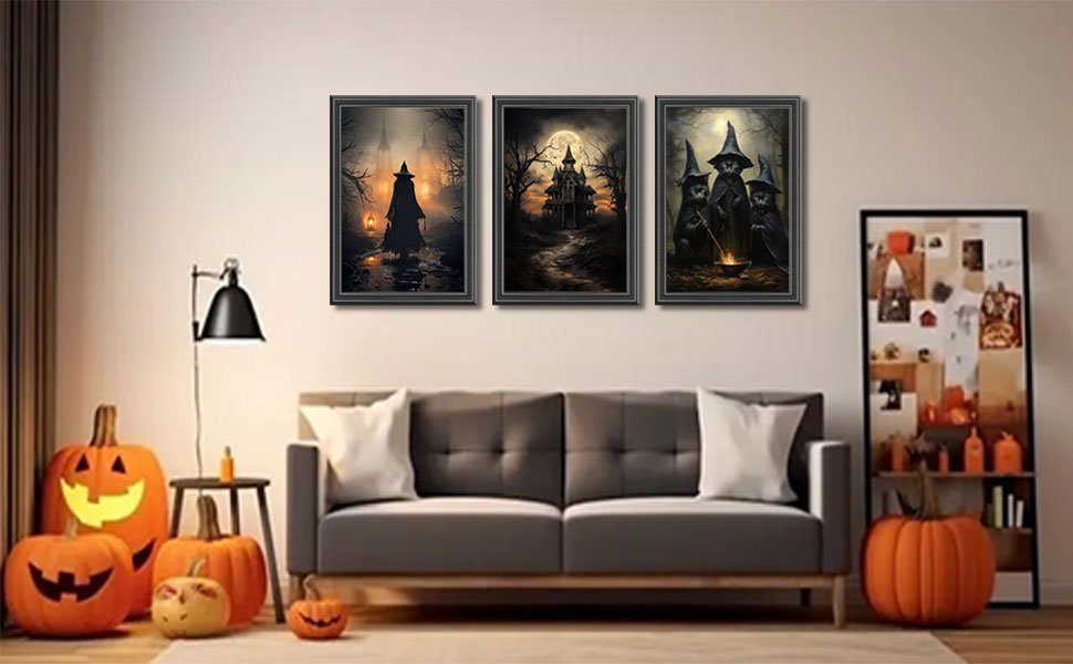 Three framed Halloween canvas art prints depicting witches and a haunted castle, displayed above a sofa in a living room with pumpkins.