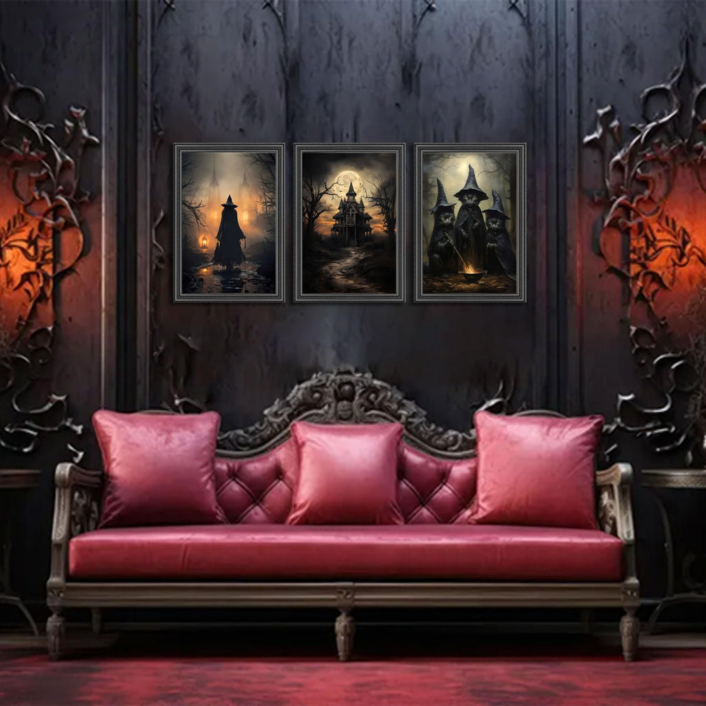 Three framed Halloween canvas art prints depicting witches, a haunted house, and a witch with black cats, displayed above a red tufted sofa.