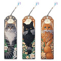 Three diamond art painting bookmarks featuring cat designs with crystal pendants, displayed side-by-side.