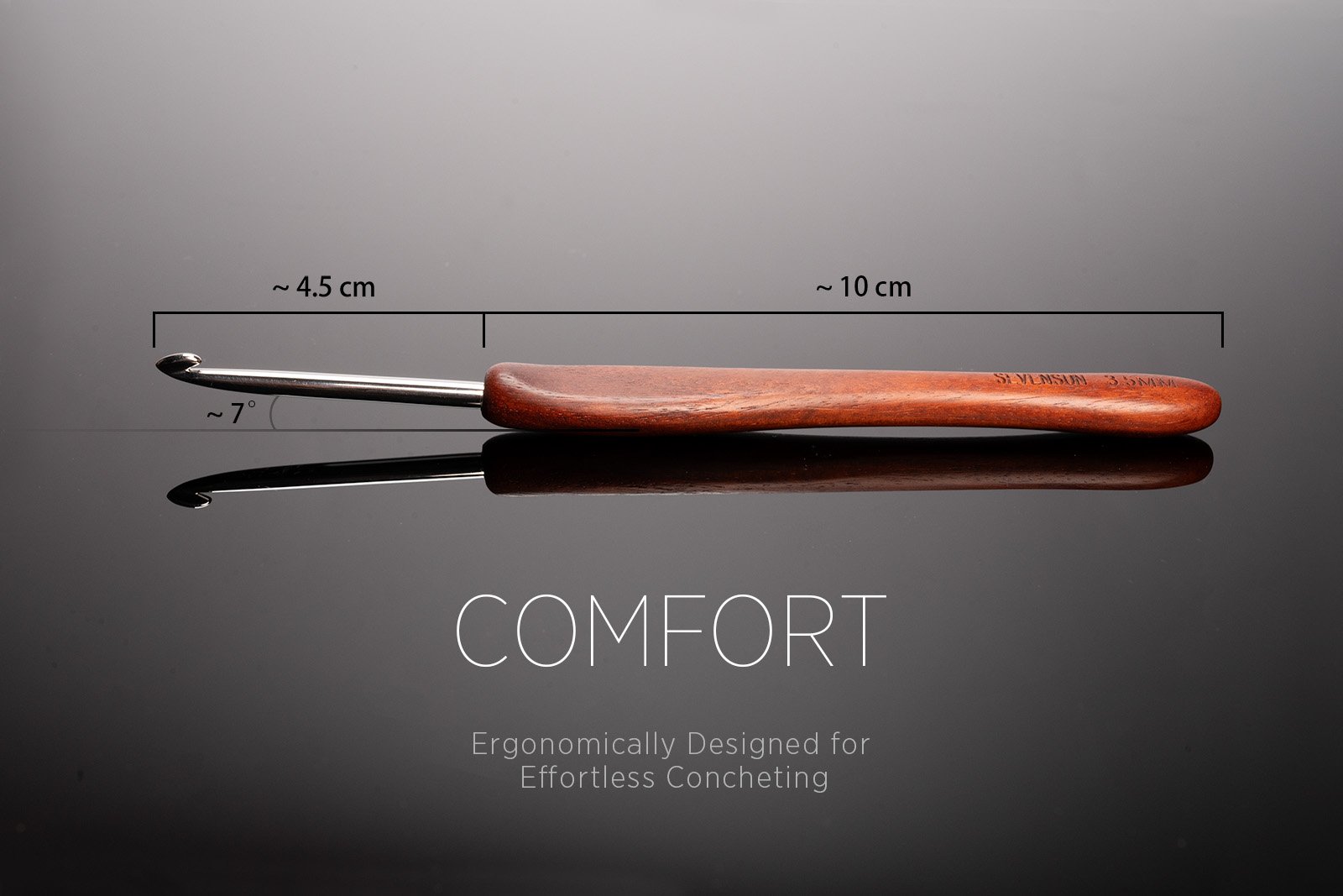 Ergonomic crochet hook with red sandalwood handle and stainless steel tip, showing dimensions and angle.