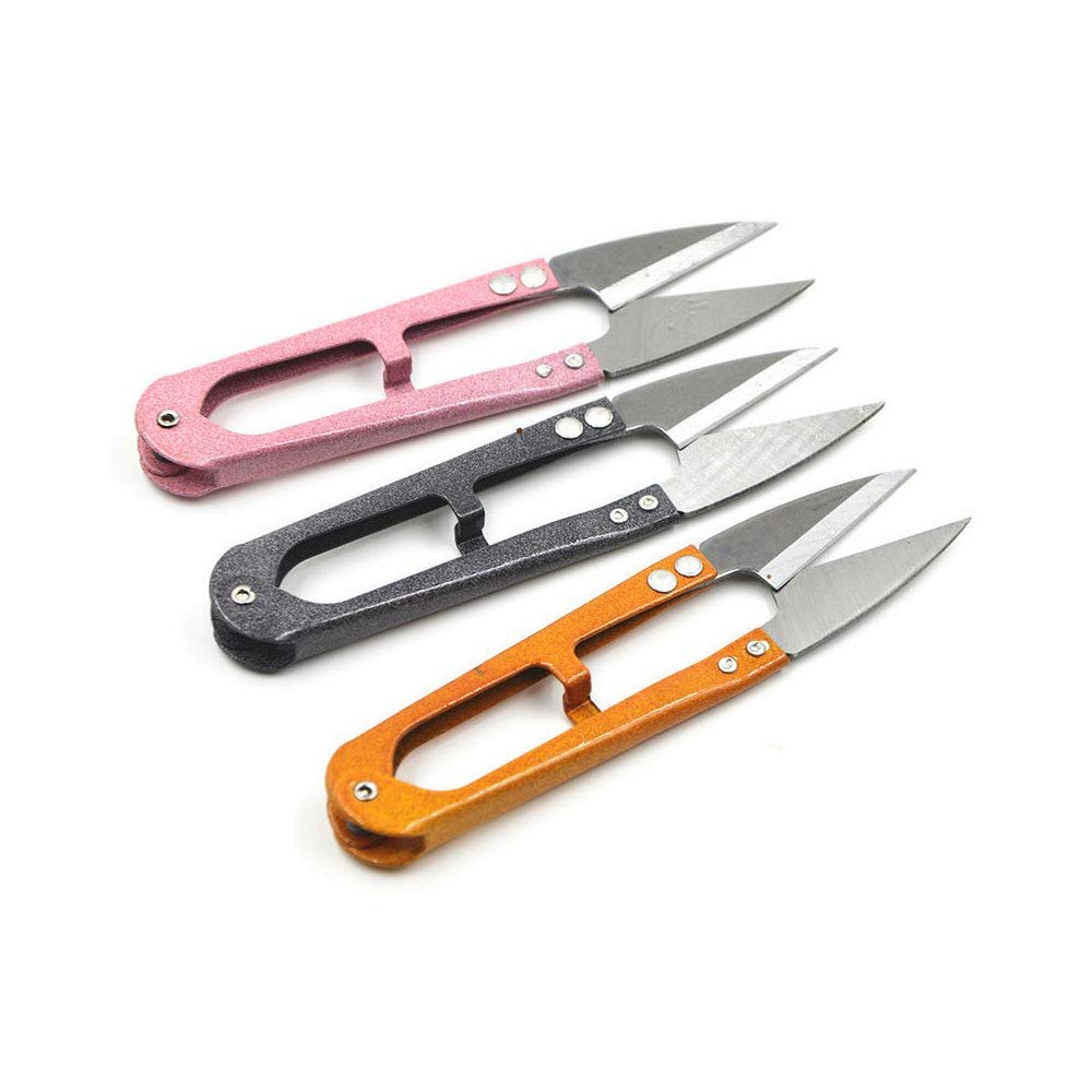 Three multicolored sewing snip scissors with sharp blades arranged diagonally on a white background.