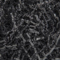 Close-up overhead view of black crinkle cut paper shred filler for gift baskets and packaging.
