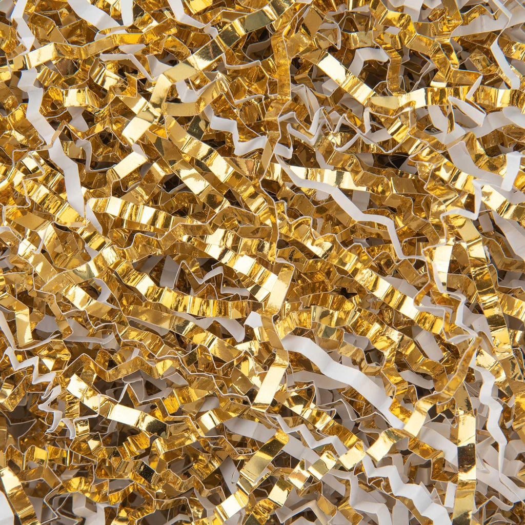 Close-up of white and gold crinkle cut paper shred filler for gift baskets and boxes.