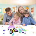 Family crafting 3D foam butterflies together at a table, with foam pieces scattered around.
