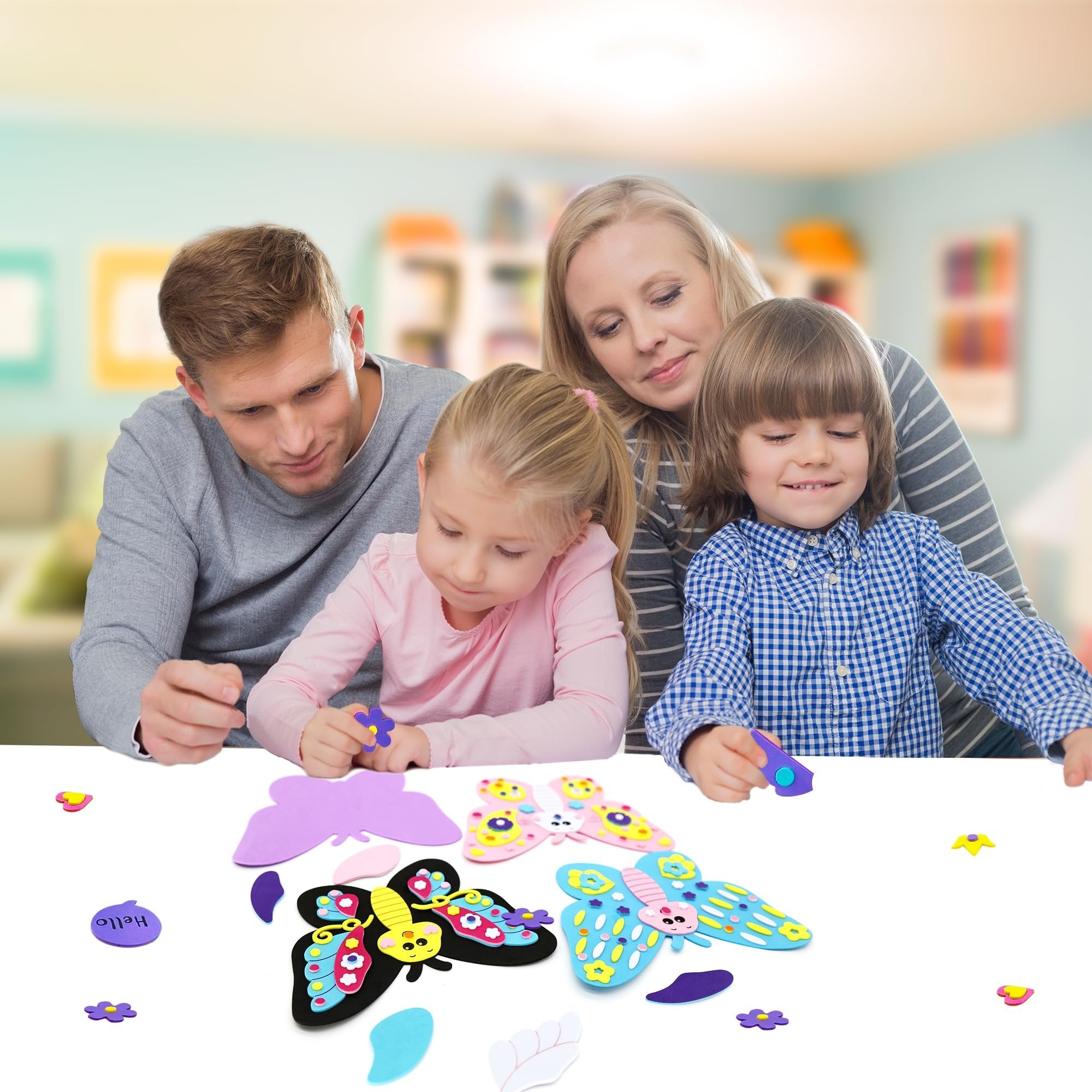 Family crafting 3D foam butterflies together at a table, with foam pieces scattered around.