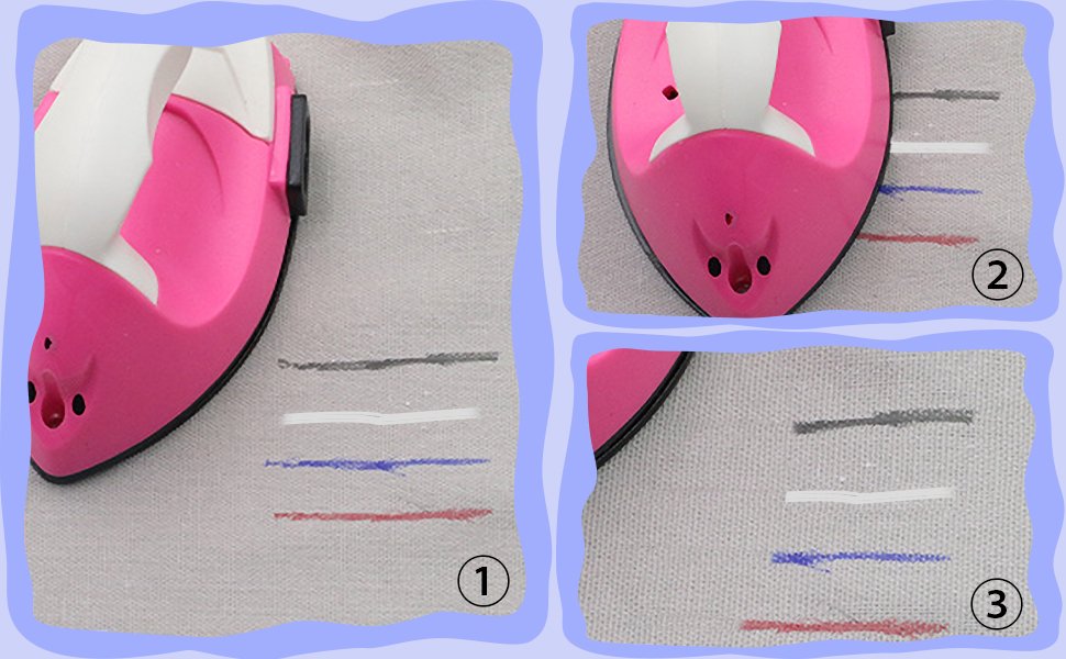 Close-up of a pink heat iron over fabric with lines of black, white, blue, and red marker ink, showing heat erasing effect.