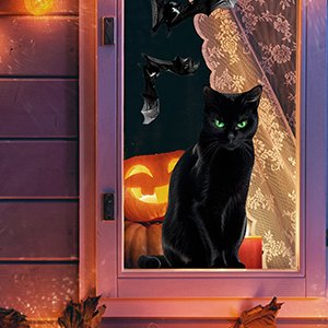 Black cat with green eyes sits on a windowsill with a carved pumpkin and bats behind it, decorated for Halloween.
