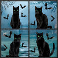 Four black cats with green eyes sit in a window with bats and spiderwebs for Halloween